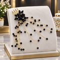 Elegant Black & Golden Hair Accessory ✨ Add a touch of elegance to your look with this beautiful black floral hair accessory, featuring sparkling black beads