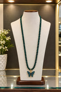 Elegant Butterfly Beaded Necklace ✨ Beautiful dark green beaded necklace with a stunning blue butterfly pendant and elegant golden detailing.