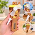 Cute Bear Milk Cup Mini Hand Fan – Portable Handheld Fan for Kids & Adults Stay cool in style with this adorable Bear Milk Cup Mini Fan!