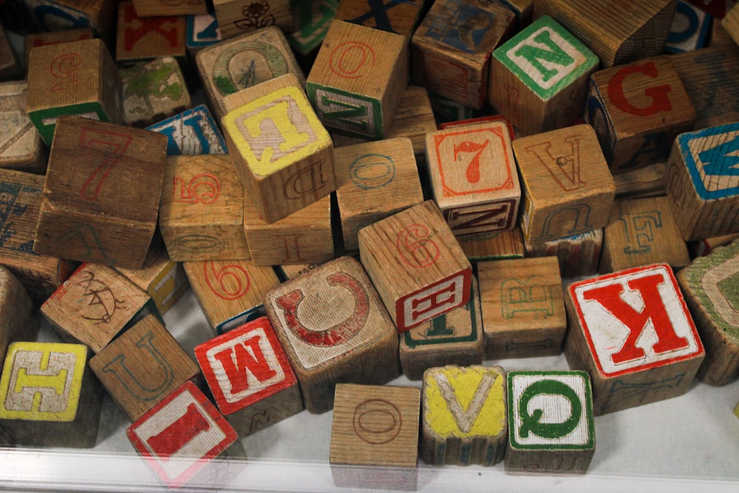 Vintage wooden alphabet blocks in a pile